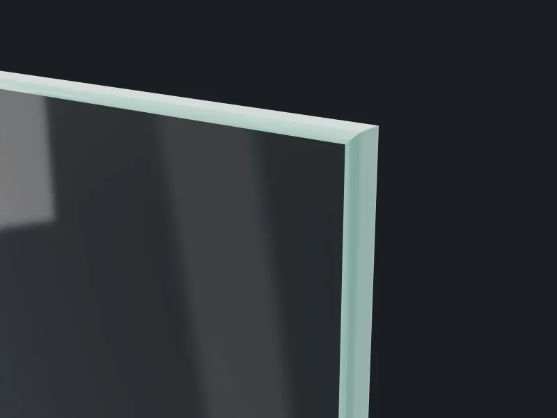 Corner of a clear glass tabletop with a rounded polish edge